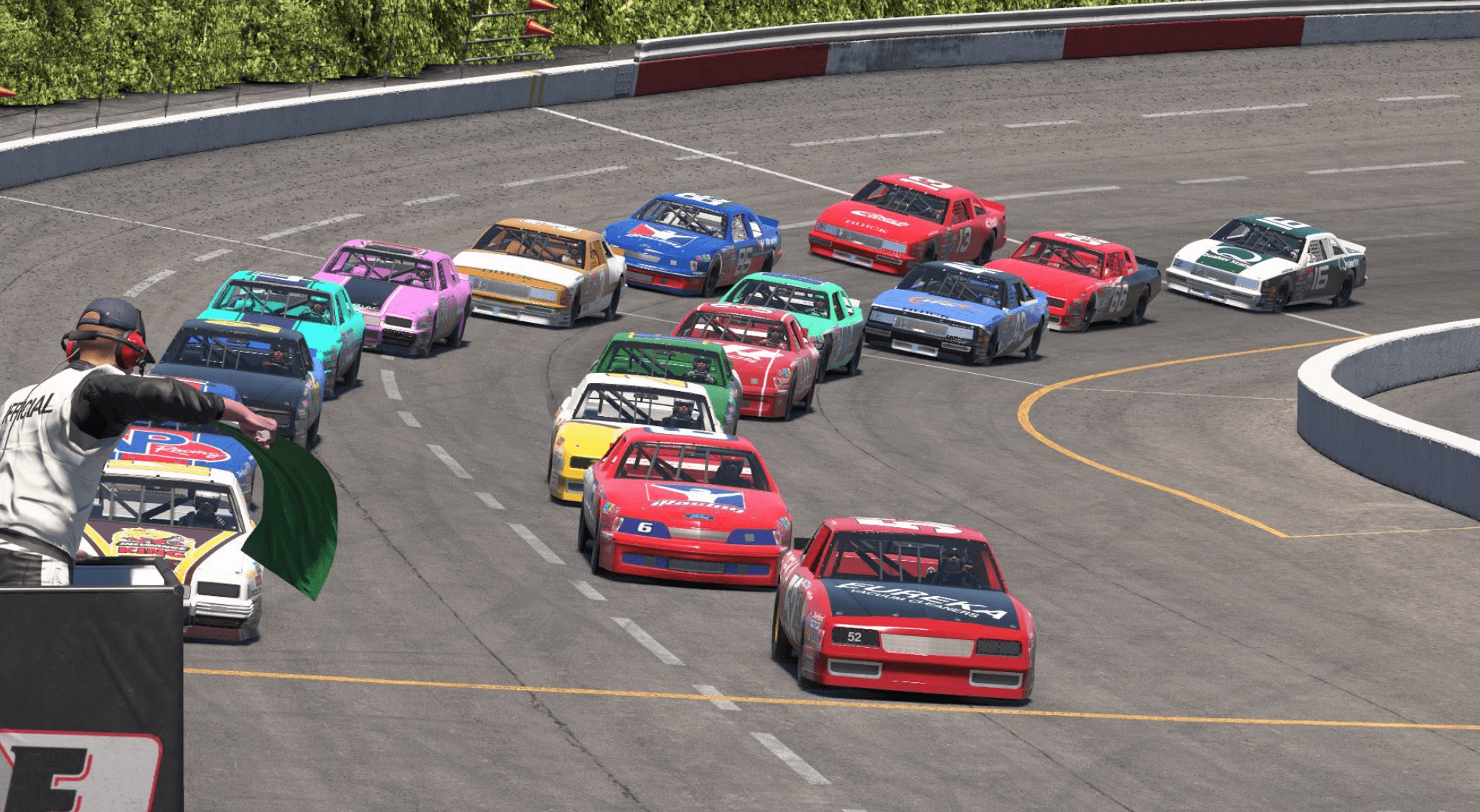 A colorful field taking the green flag on a short oval